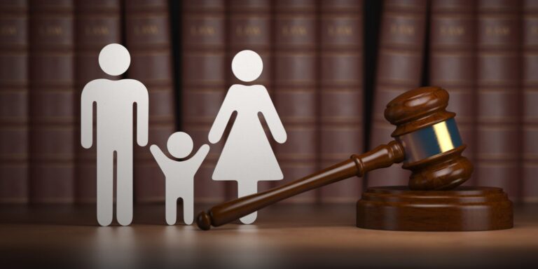 Child Support New Jersey - paper cut out family with gavel and legal books