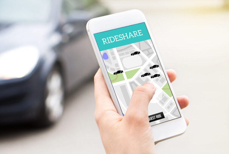 Ride share taxi service on smartphone screen